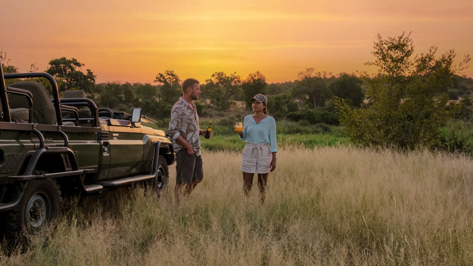 Couple on safari at sunset in South Africa